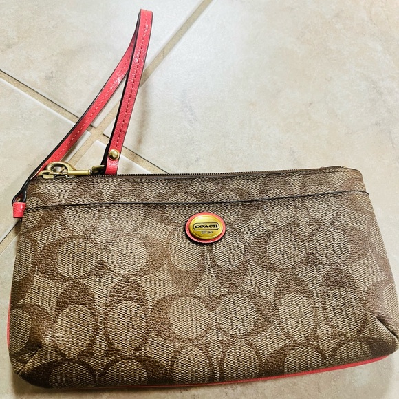 Coach Handbags - Coach Signature Brown Wristlet with Red Trim